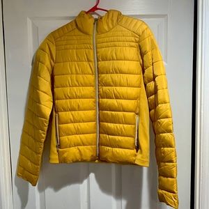Yellow puffer jacket.Size Medium